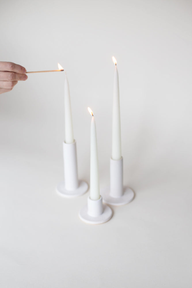 A handthrown ceramic taper candle holder in our signature off-white glaze.