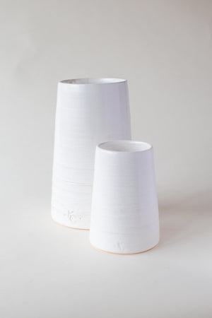 A handthrown and unique ceramic vase in our Kinship Collection off-white glaze.