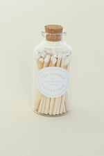 An apothecary match bottle with cork top.